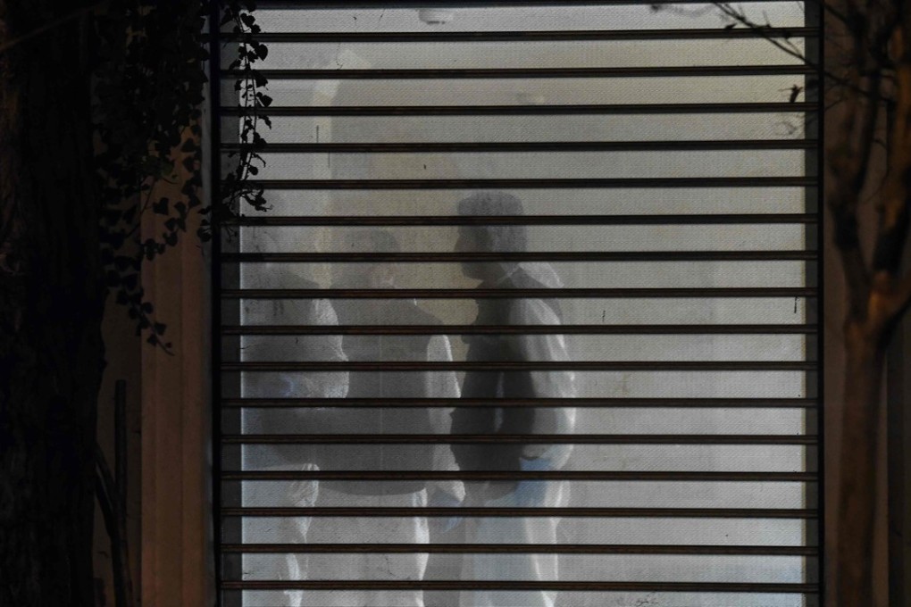 Police can be seen through a window inside the residence of the Saudi consul to Istanbul. Photo: AFP