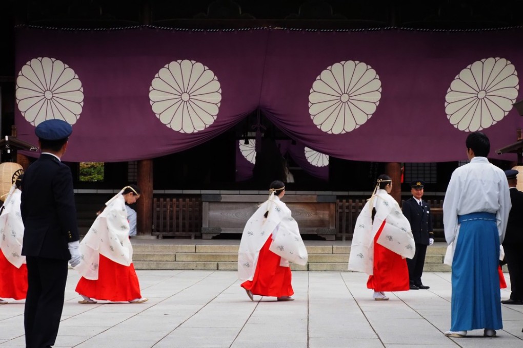 Yasukuni Shrine maidens walk after attending a Shinto ritual during the four-day autumn festival at the shrine in Tokyo on Wednesday. Photo: Agence France-Presse