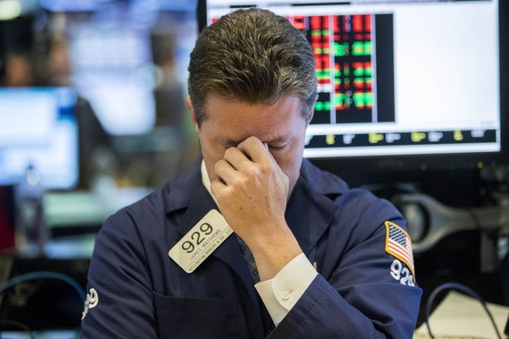 A trader at the New York Stock Exchange on October 11 – a day when US stocks suffered deep losses in volatile trading. Photo: Xinhua