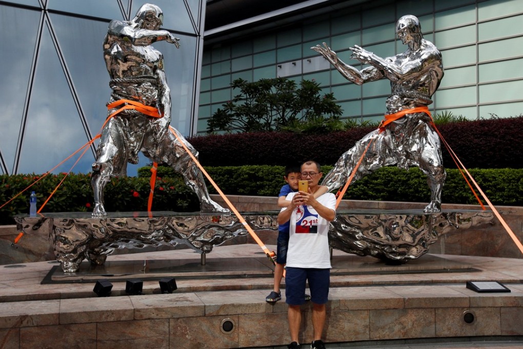 While Hong Kong may have secured these sculptures in its Central district against Typhoon Mangkhut, which hit the city last month, the former British colony needs to do more to effectively combat financial crime. Photo: Reuters