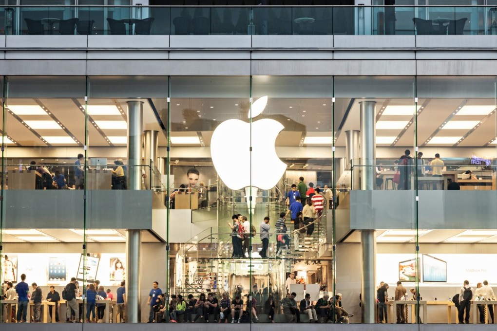 Customers browsing at an Apple store