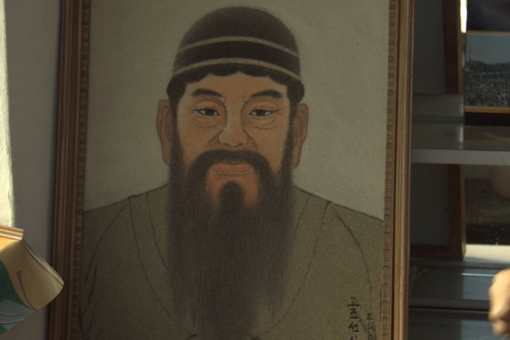 A picture of King Dangun, the mythical founder of the first unified Korean kingdom in 2333 BCE, sits at a tourist stand near what North Korea says is his tomb, just outside Pyongyang. Photo: Reuters