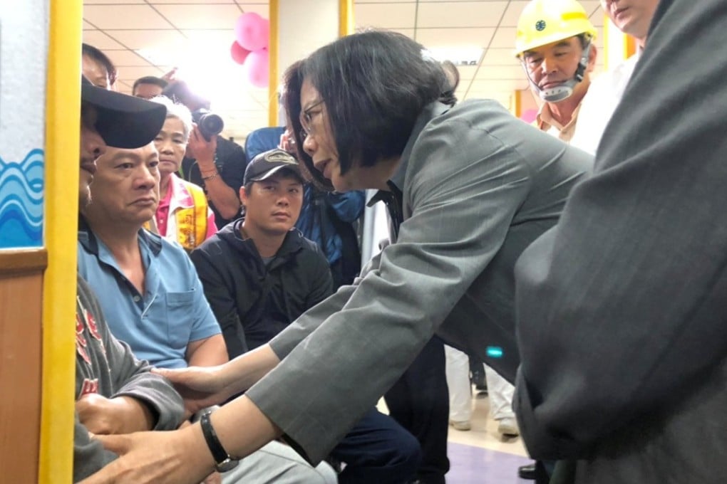 Taiwanese President Tsai Ing-wen speaks to relatives of those killed or injured in the crash. Photo: Reuters