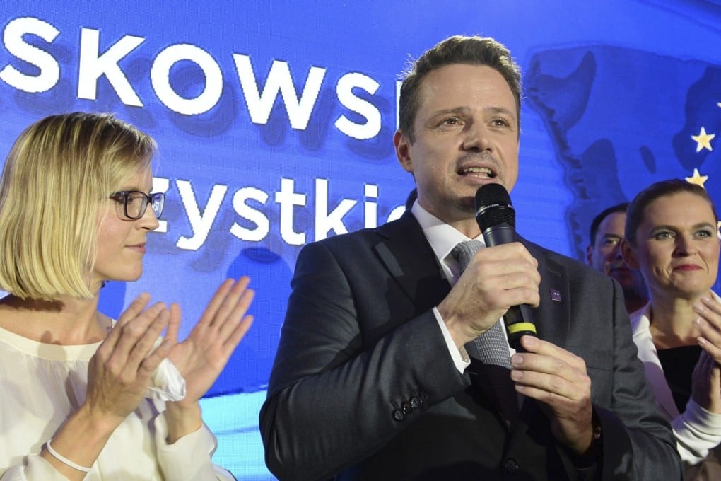 Warsaw city mayor candidate from the main opposition party Civic Platform, Rafal Trzaskowski speaks to supporters after first exit polls indicating him as the winner are announced in Warsaw. Photo: AP Photo