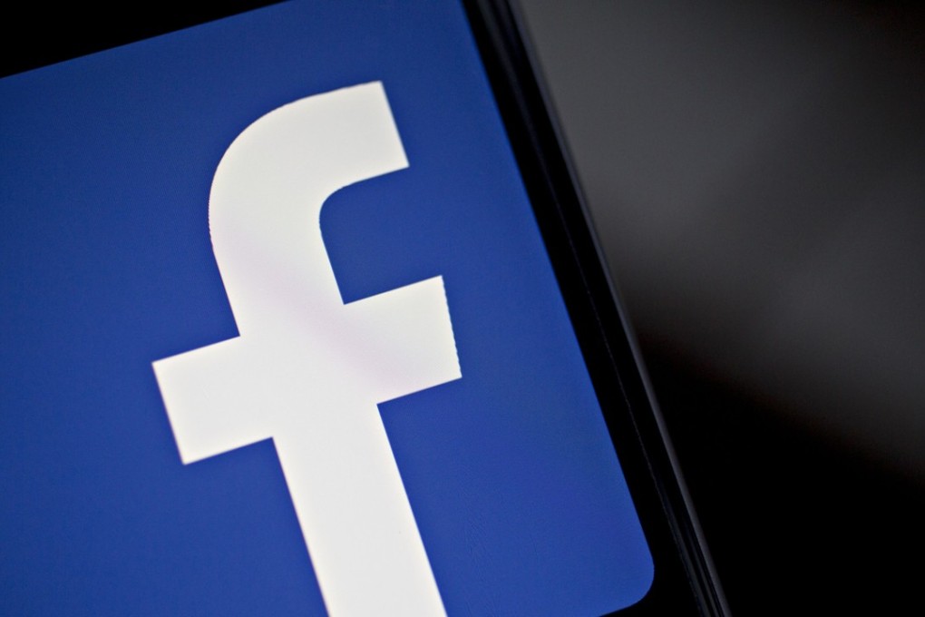 The Facebook logo is displayed for a photograph on an Apple iPhone. Japan has ordered the social media giant to improve its data protection measures. Photo: Bloomberg