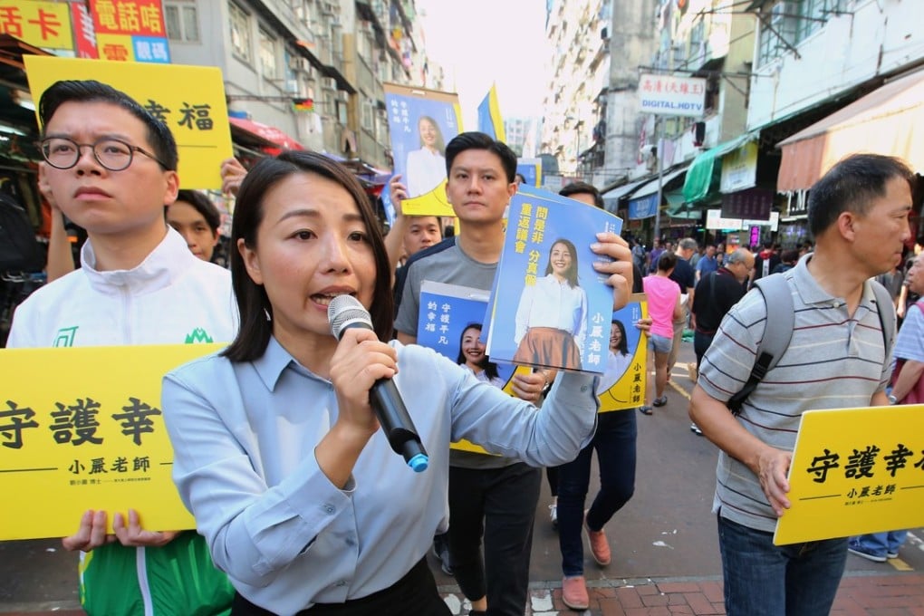 Lau Siu-lai campaigns at a by-election rally at Sham Shui Po in early October. Lau has since been barred from seeking office based on her past support for Hong Kong “self-determination”. Photo: Edmond So