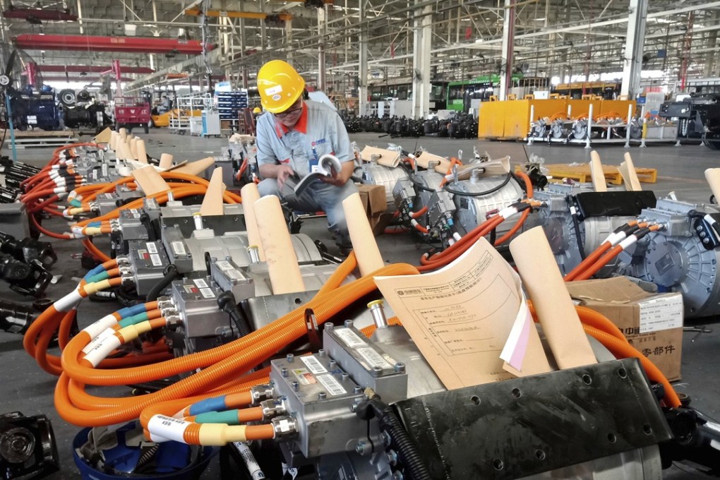 Aman works in an auto parts factory in Liaocheng in eastern China's Shandong province. Automobiles make up a large part of the US$376 billion US trade deficit with China. Photo: AP