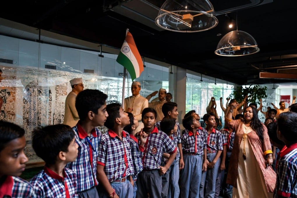 Indian students from Kendriya Vidyalaya in Dwarka listen to a guide explain the Indian independence movement inside the Indian President's House museum in New Delhi. Photo: AFP