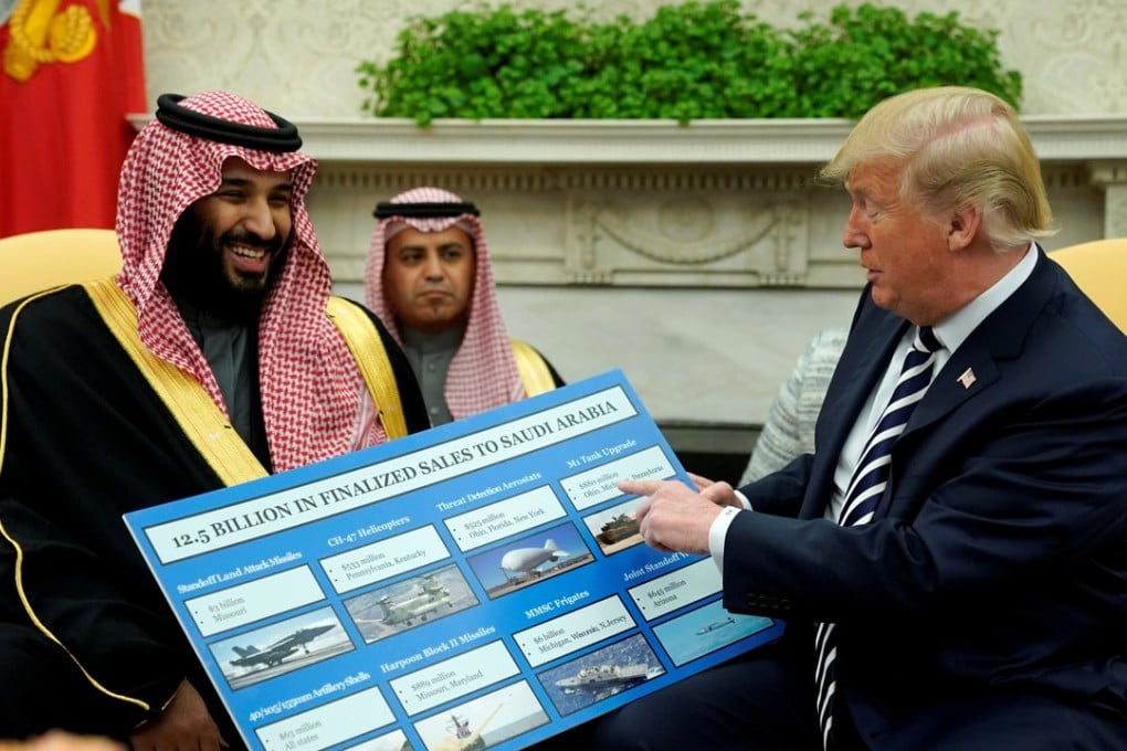 US President Donald Trump holds a chart of military hardware sales as he welcomes Saudi Arabia's Crown Prince Mohammed bin Salman in the Oval Office at the White House in March. File photo: Reuters