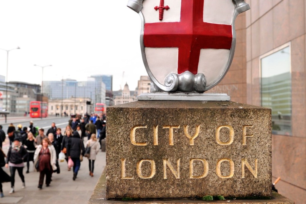 Workers leave the City of London at the end of the working day. Photo: AFP