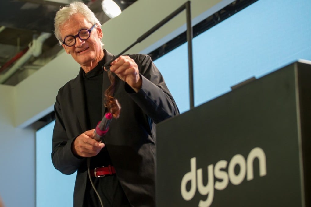 James Dyson, the billionaire founder and chairman of household appliance company Dyson, shows a new grooming device at an event in New York earlier this month. The British firm has selected Singapore as the site of its manufacturing facility that will produce electric cars. Photo: Bloomberg
