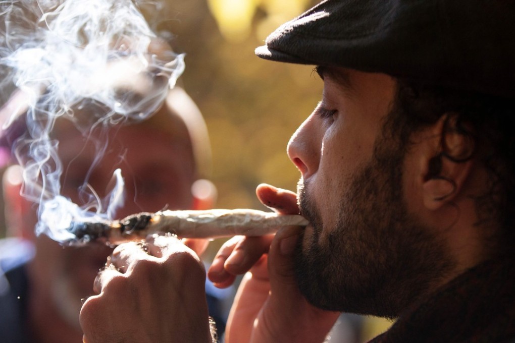 A man smokes a marijuana cigarette in Toronto. Photo: AFP