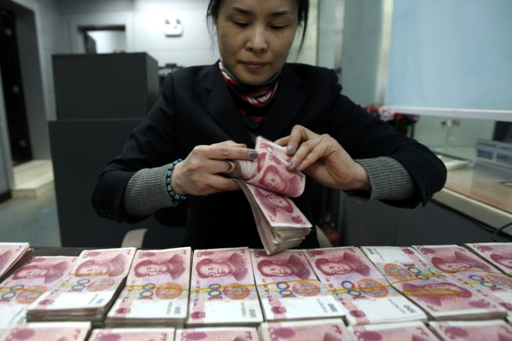 The seven yuan to one US dollar mark has been considered “psychologically important” but word is spreading that China may now be willing to let its currency depreciate beyond that. Photo: AP
