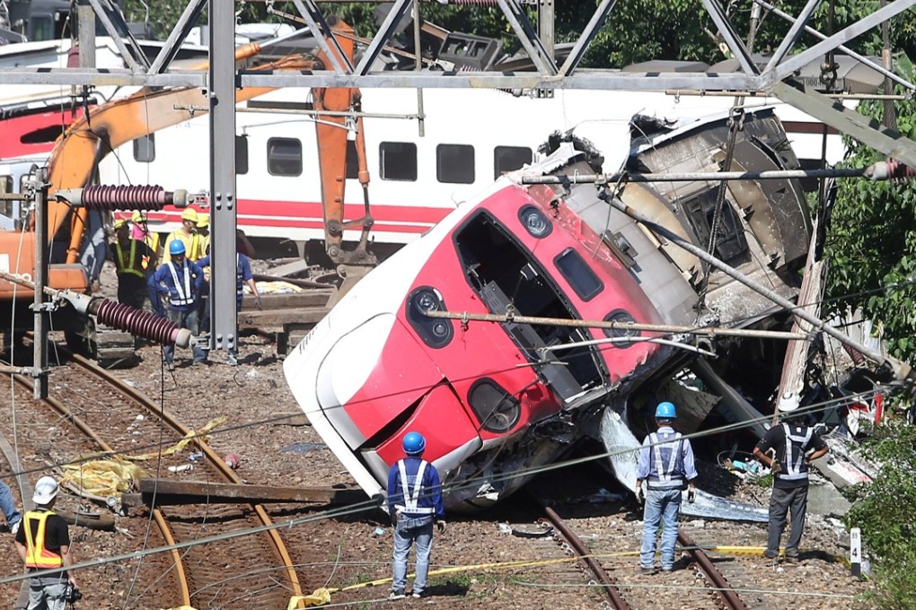 Rescuers work at the site on Monday where a train derailed in Yilan county, Taiwan. Photo: Reuters