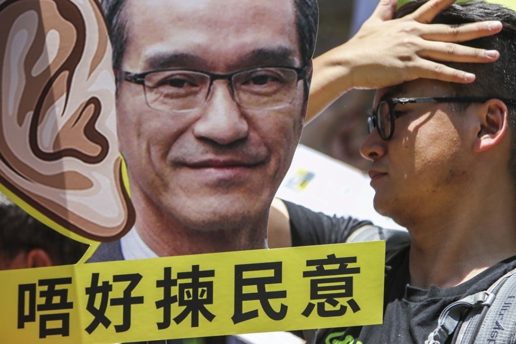 Protesters rally at the Leighton Hill Community Hall in Happy Valley during a public forum organised by the Task Force on Land Supply in June. The land supply public consultation is one of the most high-profile public engagement exercises held this year. Photo: Winson Wong