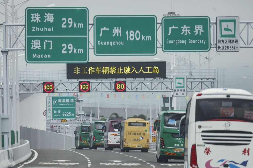 Coaches cross the Hong Kong-Zhuhai-Macau Bridge shortly after it opened to the public for the first time on Wednesday. Photo: Dickson Lee