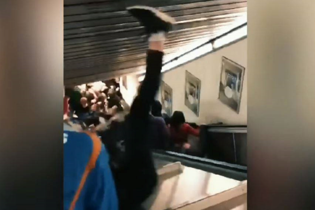 Passengers dive for safety as an escalator accelerates out of control in Rome's metro system on Tuesday. Photo: YouTube
