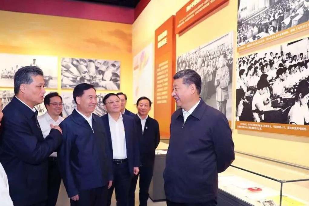 Chinese President Xi Jinping (right) visits an exhibition in Shenzhen on Guangdong’s leading role in reform and opening up 40 years ago. Source: People’s Daily