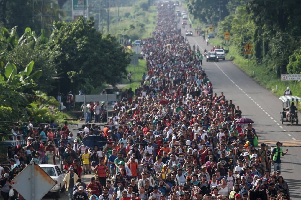 A caravan of thousands of migrants from Central America walk towards Tapachula from Ciudad Hidalgo while en route to the United States. Photo: Reuters