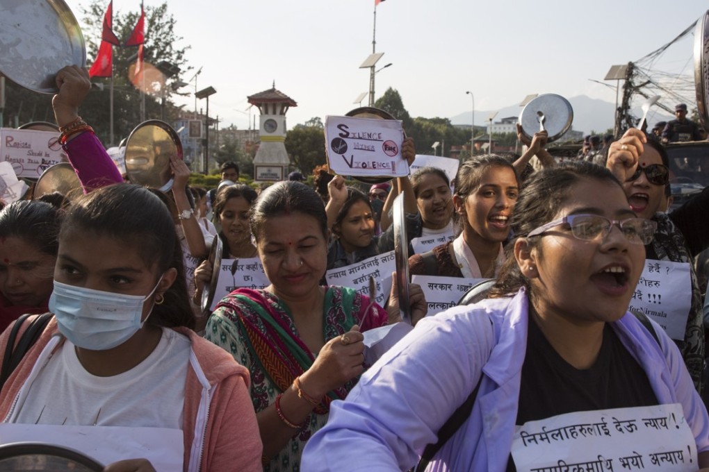 Nepalese protesters hit dinner plates with spoons during a protest calling for justice for teenager who was raped and murdered. Photo: EPA