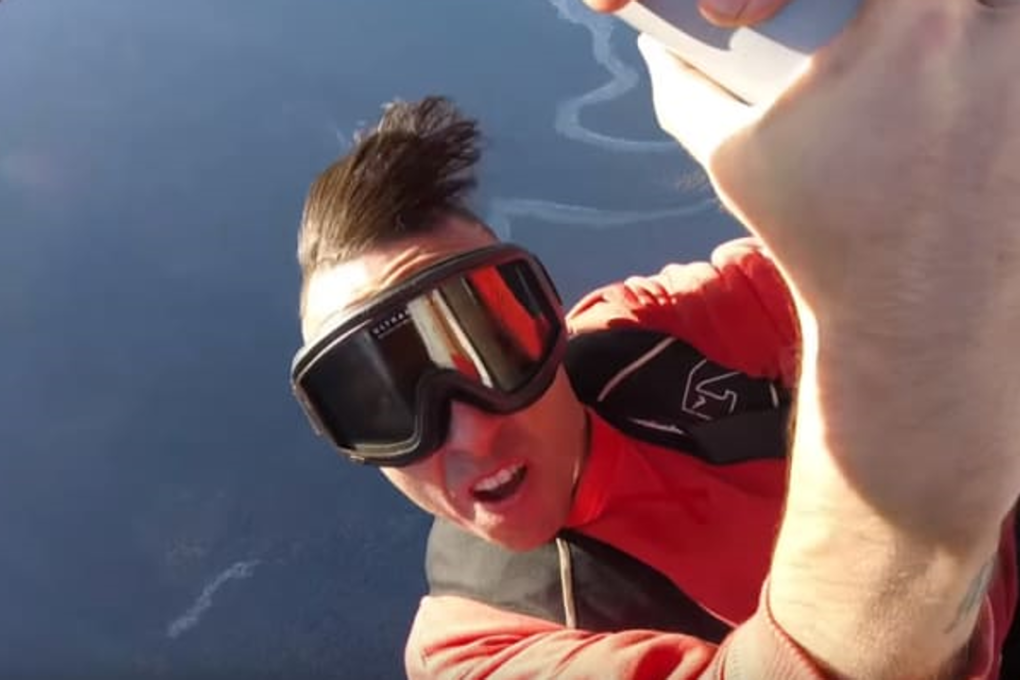 Canadian rapper Jon James McMurray performs a plane stunt in a music video. McMurray would die in a different stunt, in which he rapped while wingwalking. Photo: YouTube