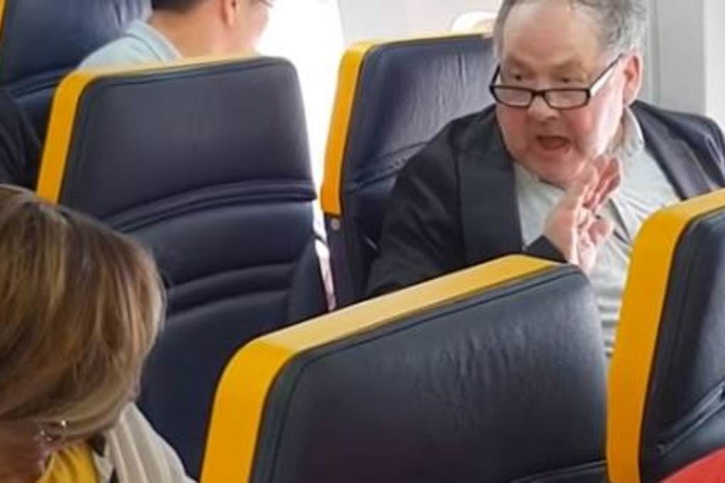A still from a video, uploaded to social media by Briton David Lawrence, shows a Ryanair passenger (right) hurling racist insults at an elderly black woman sitting in the same row, on a flight from Barcelona to London. Photo: David Lawrence