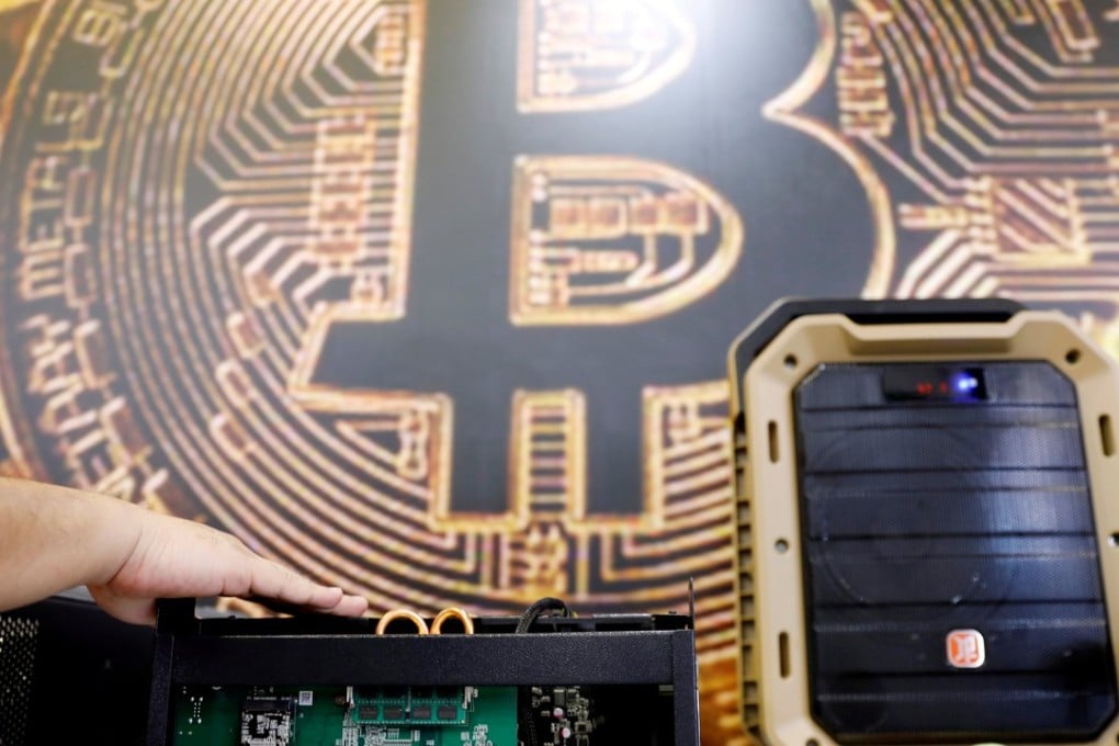 Hong Kong’s outgoing Securities and Futures Commission chairman has said the SFC is looking into regulation for cryptocurrencies to protect investors, and a total ban on such platforms is not realistic due to their international reach. Photo: Reuters