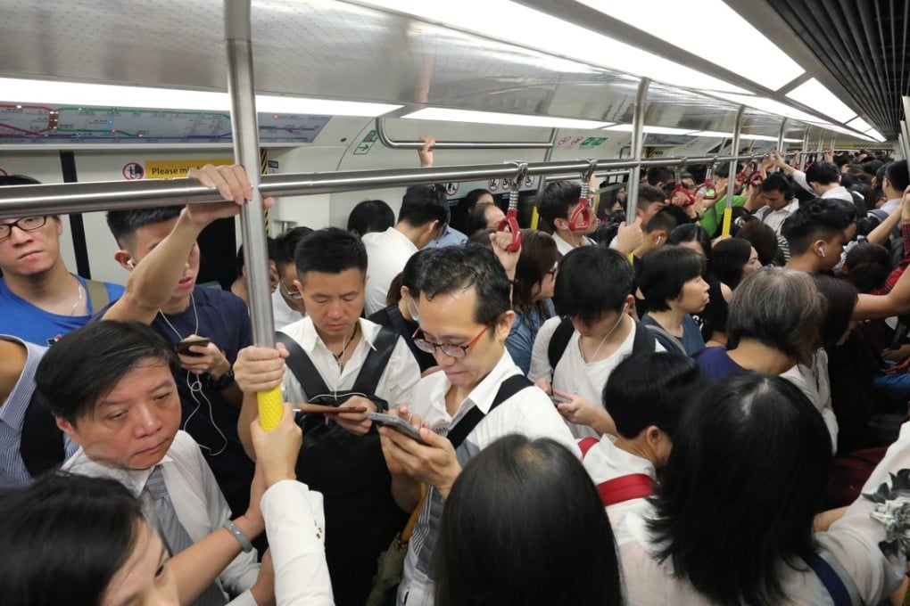 Commuters crowd into an MTR train on October 16 as the system was hit by its worst ever breakdown. Passengers faced more disruption on Thursday. Photo: Felix Wong