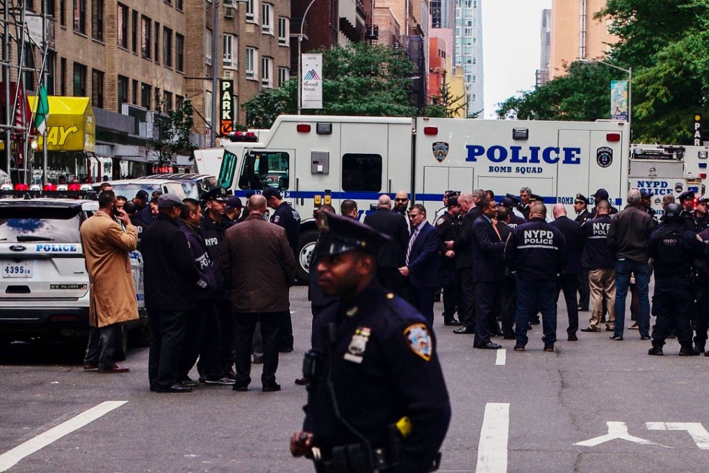 Police are seen outside CNN’s New York offices at the Time Warner Centre on Wednesday. A suspicious package was found at US news channel – one of several sent to perceived opponents of US President Donald Trump that day. Photo: Xinhua