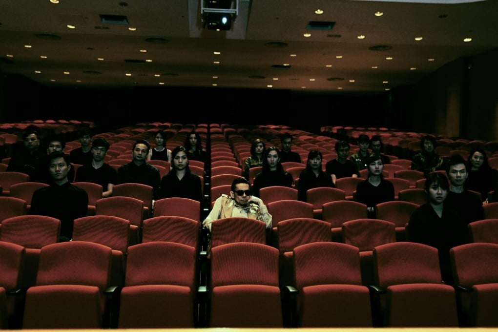 Teddy Robin (front), who also directed and co-scripted the film, in a still from Lucid Dreams (category IIB; Cantonese). The film also stars Louis Cheung, Dada Chan, Kevin Cheng, Stephy Tang, and Andrew Lam.