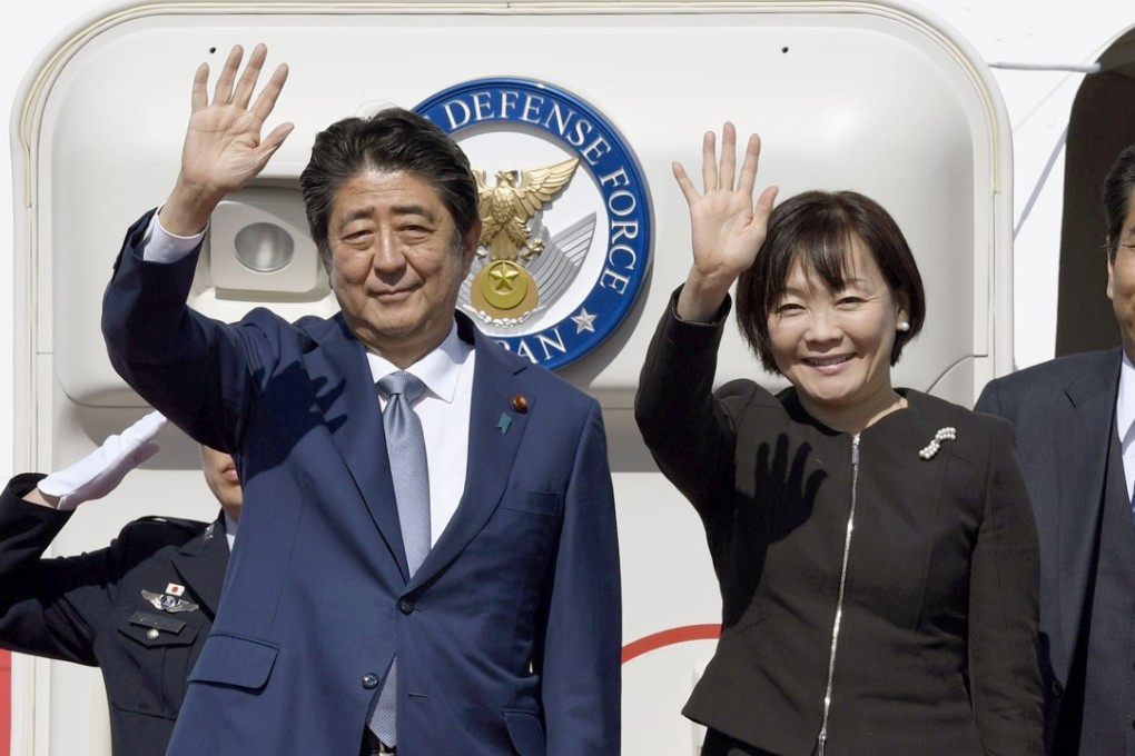Japanese Prime Minister Shinzo Abe and his wife Akie at Haneda airport in Tokyo before leaving for China today. Picture: Kyodo
