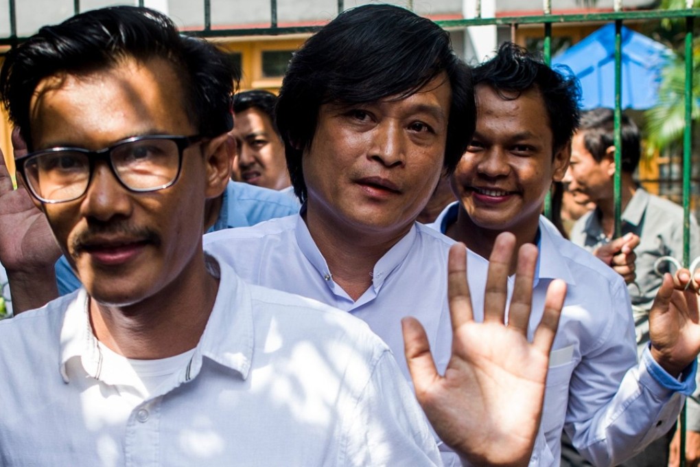 Journalists Kyaw Zaw Lin, left, followed by Nayi Min, centre, and Phyo Wai Win leave the court compound after the court hearing. Photo: AFP