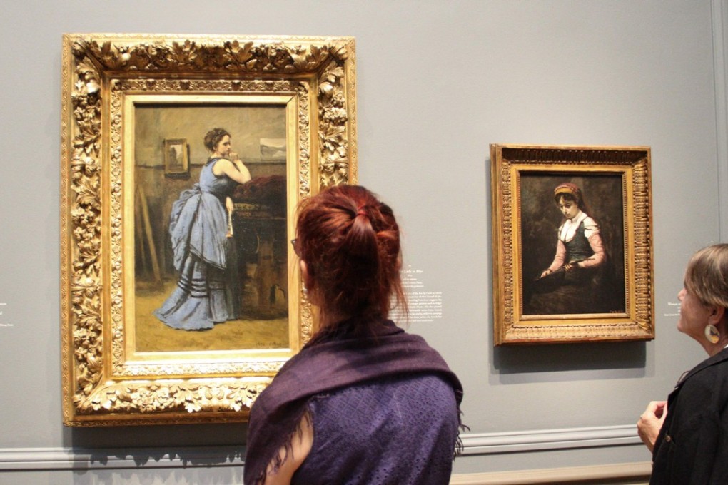 A woman looks at Jean-Baptiste-Camille Corot's ‘The Lady in Blue’ at the National Gallery of Art in Washington. Doctors in Canada are starting to prescribe visits to art museums as feel-good therapy. Photo: AFP