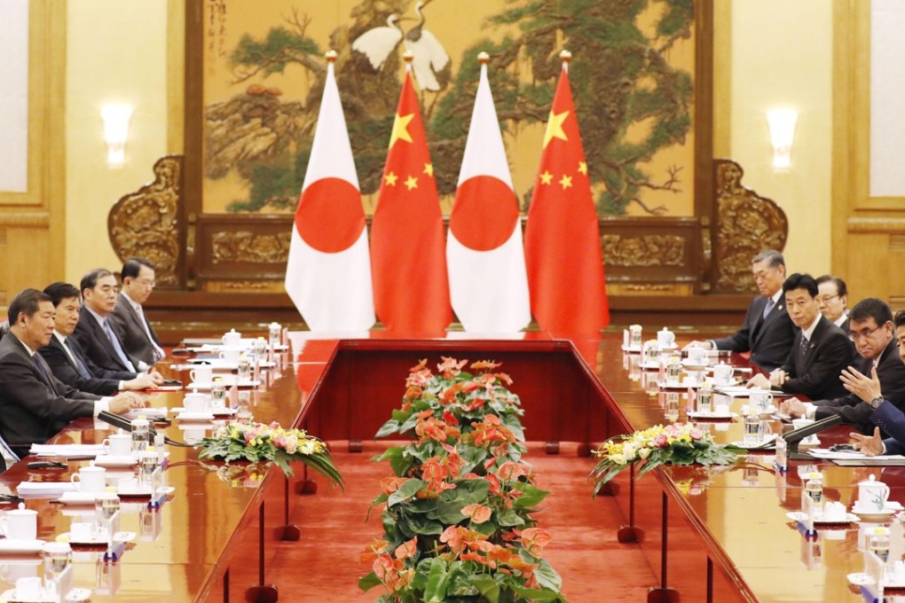 Chinese Premier Li Keqiang (far left) and Japanese Prime Minister Shinzo Abe (far right) hold talks at the Great Hall of the People in Beijing on Friday. Photo: Kyodo