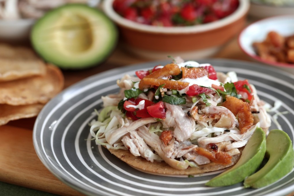 Susan Jung’s garlic chicken tostadas with cabbage, salsa, crushed avocado and chicken cracklings are the ideal way to make use of old tortillas. Photography: Jonathan Wong. Styling: Nellie Ming Lee