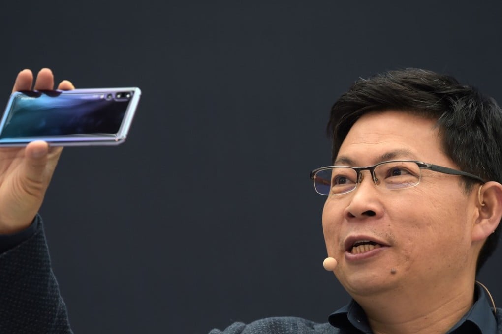 Huawei’s Richard Yu presents the P20 smartphone in Paris on March 27, 2018. Photo: AFP