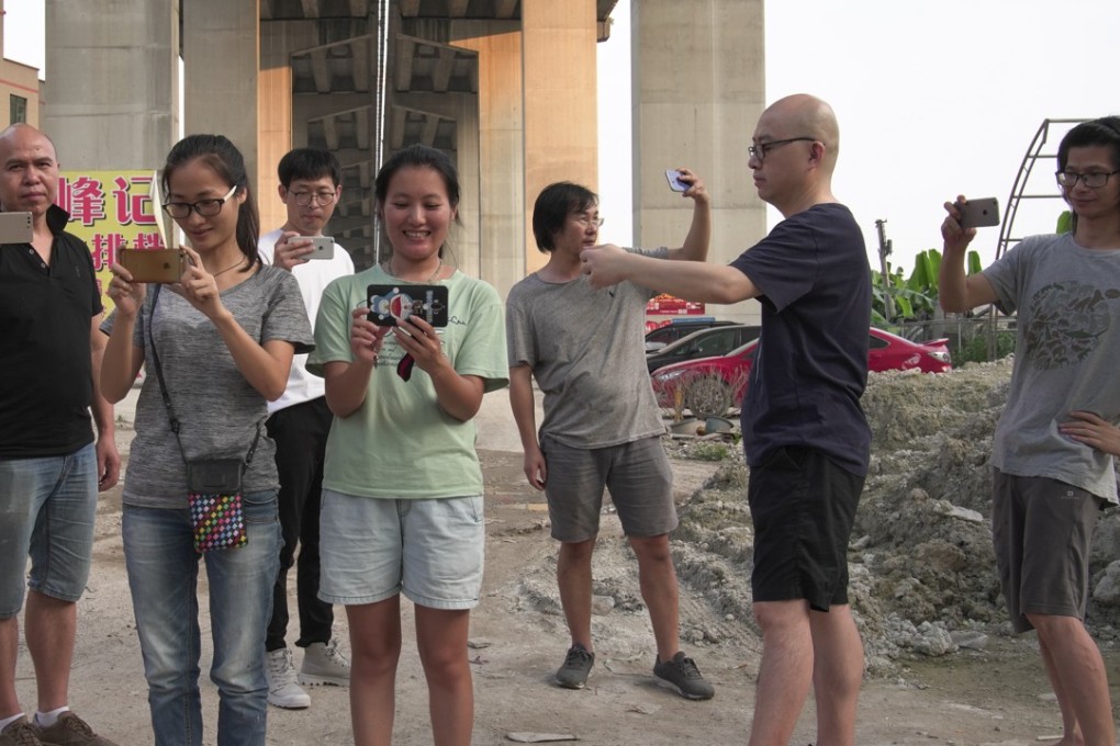 Villagers and artists pose for a photo together. Photo: Handout