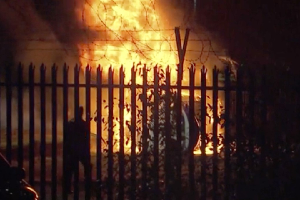 This image made from video shows a burning helicopter in a car park outside the King Power Stadium in Leicester. Photo: AFP