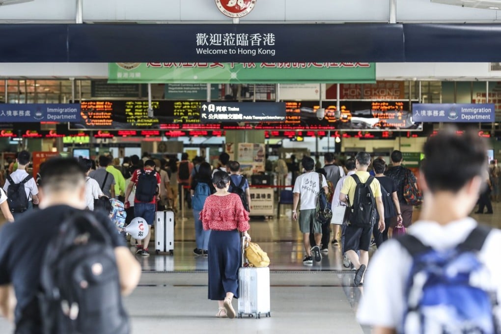People cross from Shenzhen into Hong Kong. Photo: Roy Issa