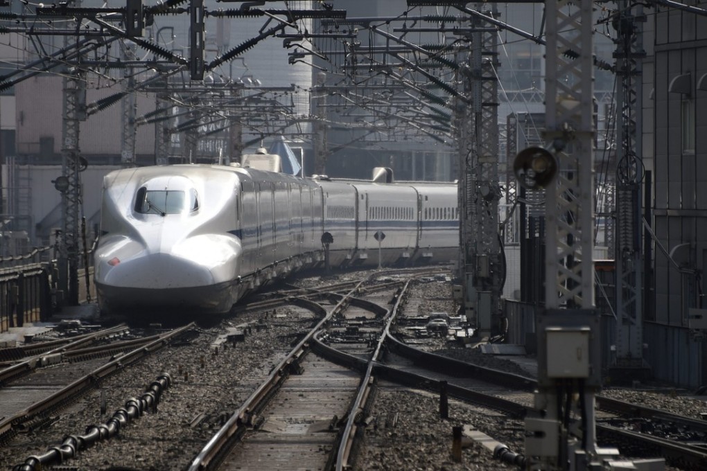 The training exercise required staff to stand next to the tracks as a bullet train sped past just one metre away. Photo: EPA
