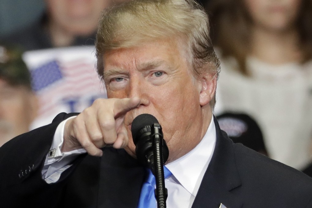 President Donald Trump points to the media as he speaks during a campaign rally in Charlotte, North Carolina, on Friday. Photo: AP