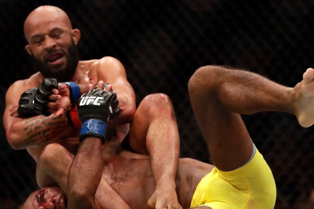 Demetrious Johnson takes down Wilson Reis during their flyweight bout on UFC Fight Night at the Sprint Centre in April, 2017. Photo: AFP