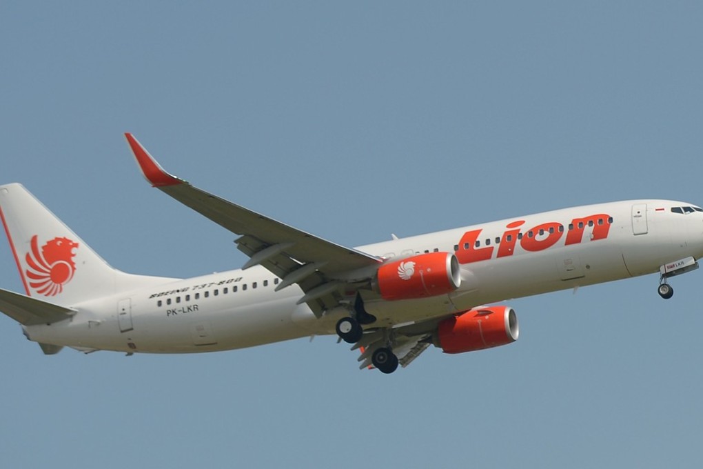 A Lion Air plane flies over Sukarno-Hatta airport in Tangerang, outside Jakarta. Photo: AFP