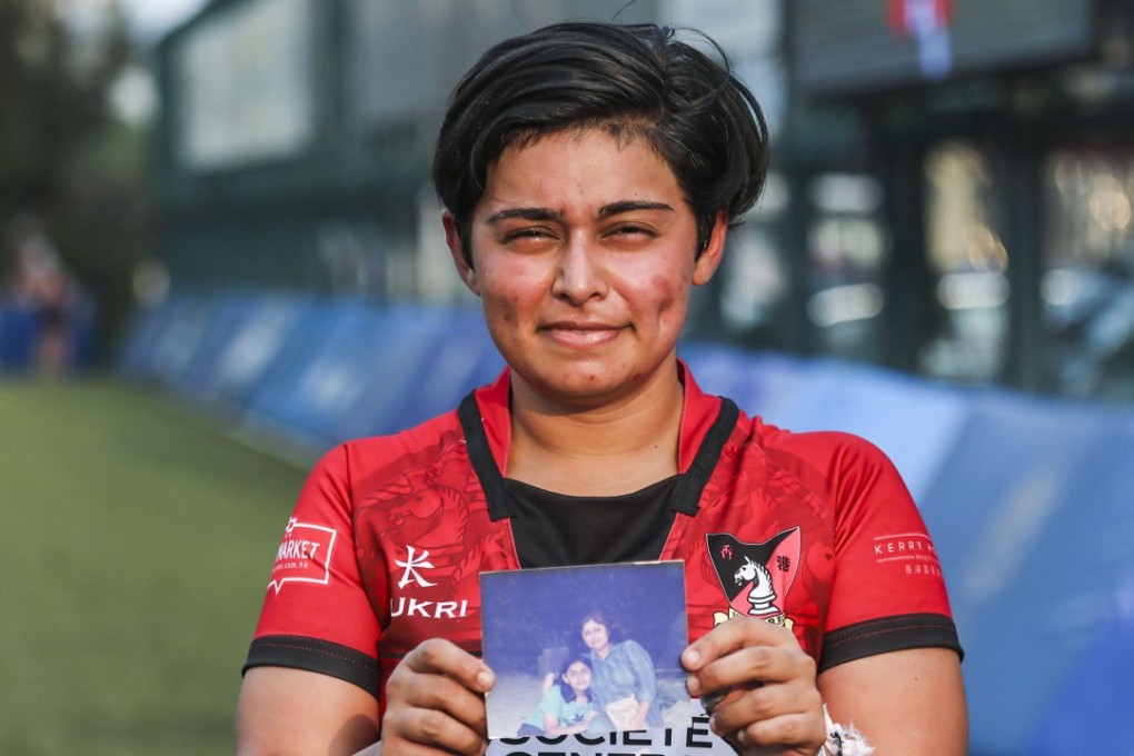 Societe Generale Valley Black Ladies player Sonia Chandiramani, holding a photo of her mum at King’s Park in Jordan. Photo: Jonathan Wong