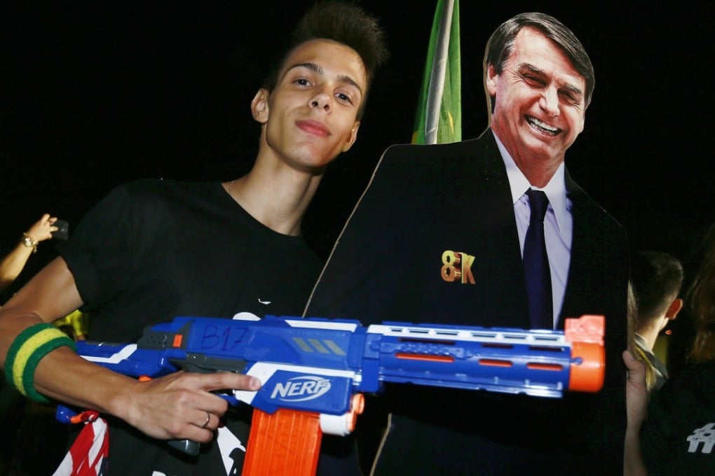 A supporter of Brazilian far-right presidential candidate Jair Bolsonaro celebrates his victory. Photo: EPA