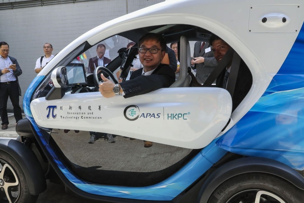 The undersecretary for Innovation and Technology, Dr David Chung Wai-keung, sits in a Streetdrone One, an autonomous driving vehicle, during the Automotive Parts and Accessory System R&D Centre Showcase, at the Productivity Council in Kowloon Tong on July 26. Photo: K.Y. Cheng