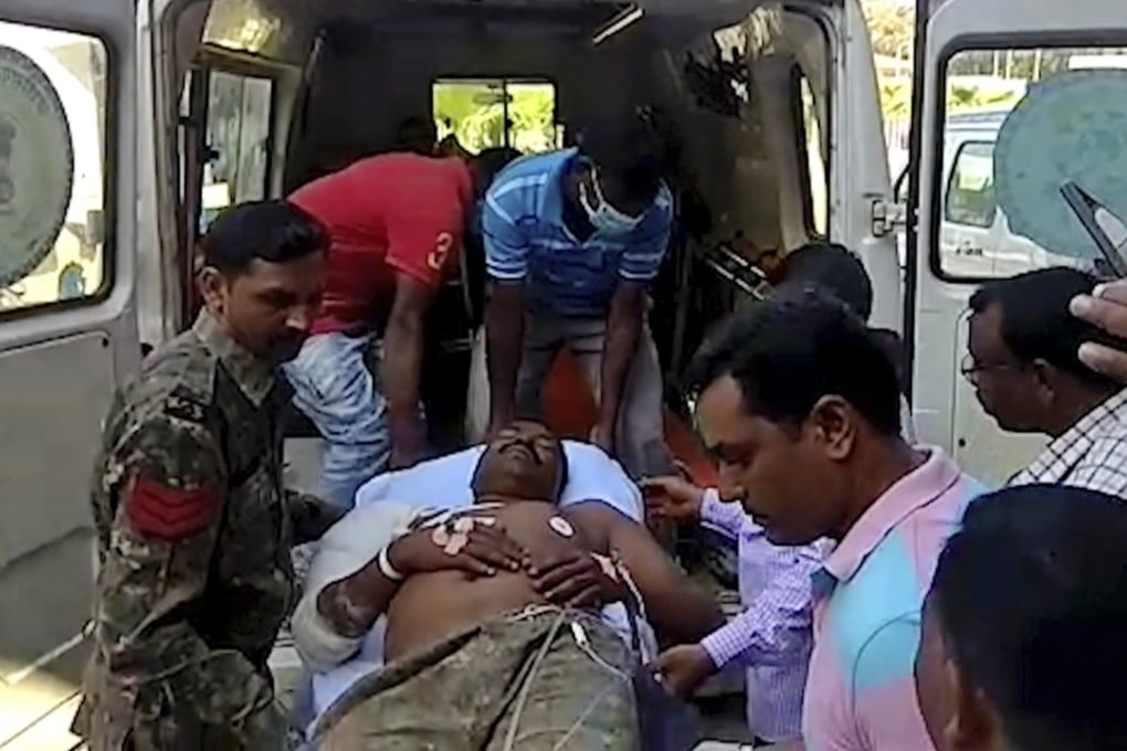 A policeman injured in an ambush is taken out of an ambulance in Dantewada district, in Chhattisgarh state, India, on Tuesday. Photo: AP