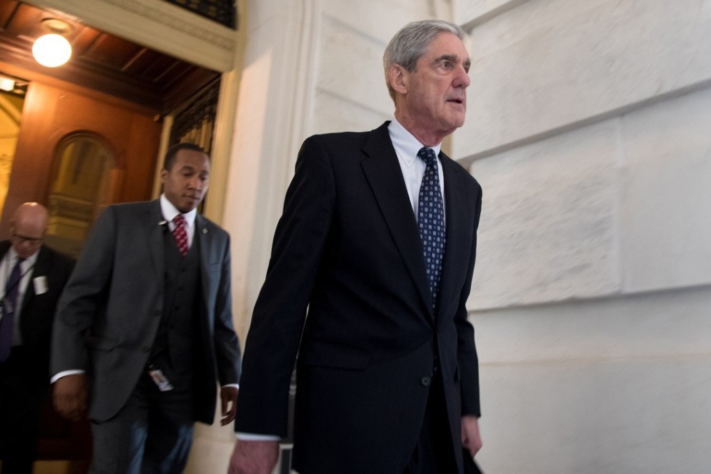 Robert Mueller, front, the special counsel probing Russian interference in the 2016 US election, leaves the Capitol building after meeting with the Senate Judiciary Committee on Capitol Hill on June 21, 2017. Photo: TNS