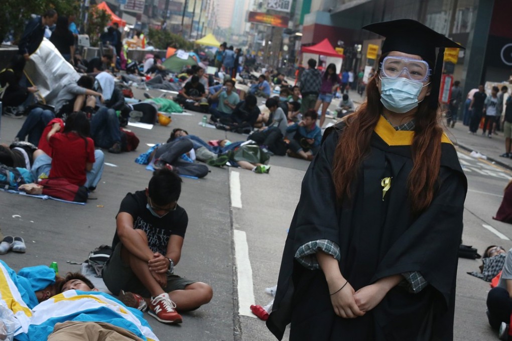 A protester wearing academic dress in Mong Kok during the Occupy movement protests in October 2014. Photo: K.Y. Cheng