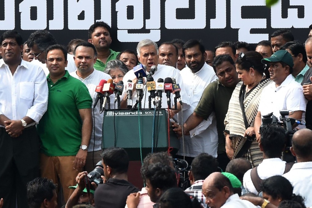 Sri Lanka’s ousted Prime Minister Ranil Wickremesinghe speaks during a protest against his removal in Colombo on Tuesday. Photo: AFP